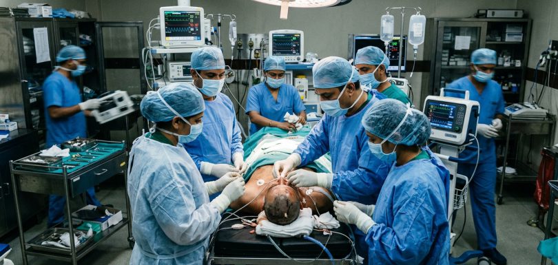 Emergency neuro-trauma surgical resuscitation team treating cranial trauma in modern Indian hospital